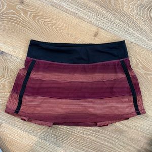 Lululemon size 6 Pace Rival skirt - orange, black & burgundy